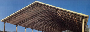 The cover of a book showing a barn with a roof.