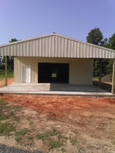 A metal building with a door on the side.